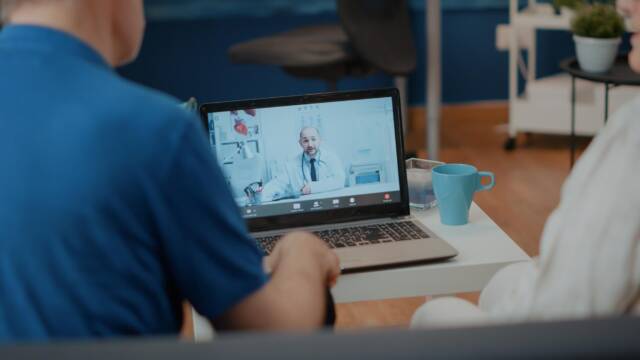 retired-couple-doing-online-consultation-video-call-with-medic-elderly-people-using-laptop-meet-with-doctor-video-teleconference-talking-about-health-care-telemedicine_482257-37351