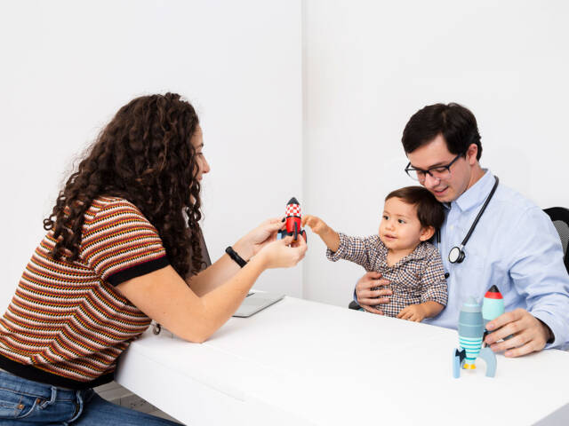 side-view-child-playing-with-toy-doctor-s-visit