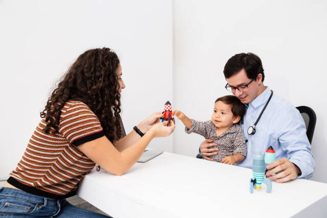 side-view-child-playing-with-toy-doctor-s-visit