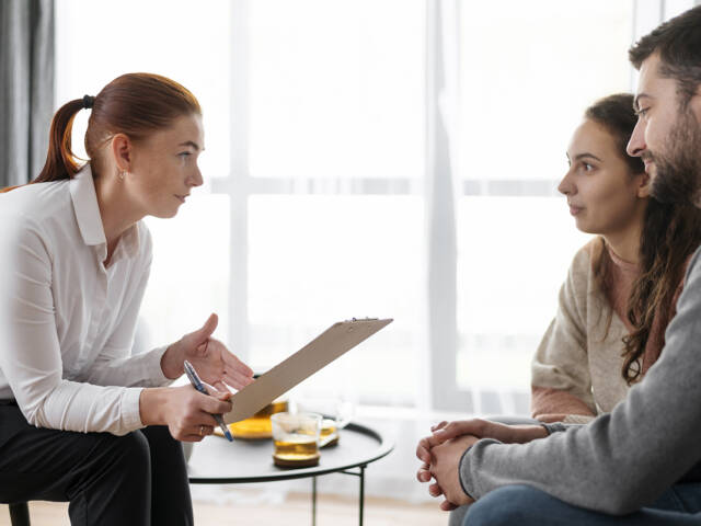 close-up-people-discussing-with-therapist