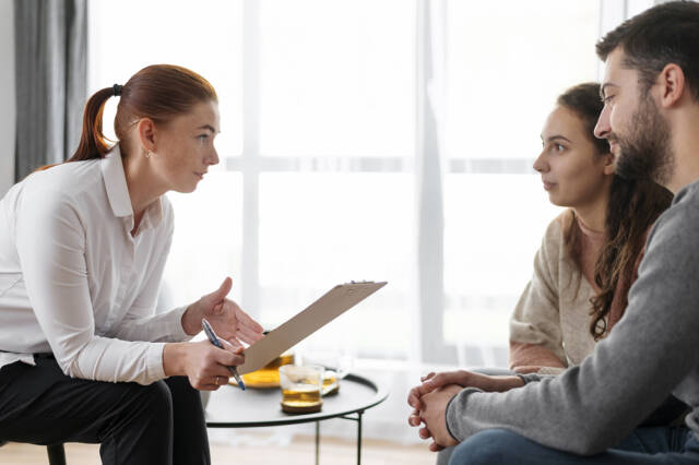 close-up-people-discussing-with-therapist